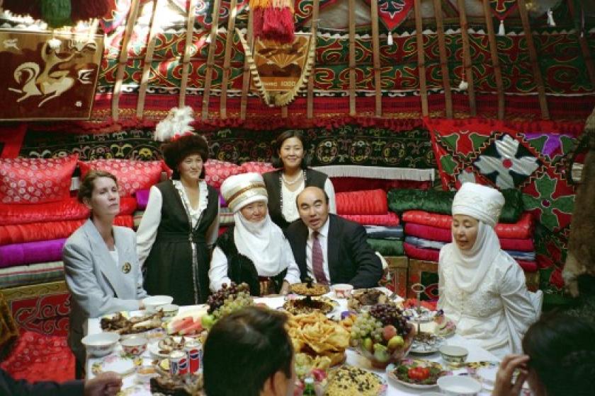 People at a banquet in a yurt