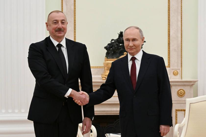 Aliyev and Putin shaking hands