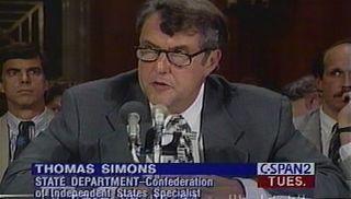 A clip from C-SPAN2 news channel of Ambassador Simons in front of a microphone 