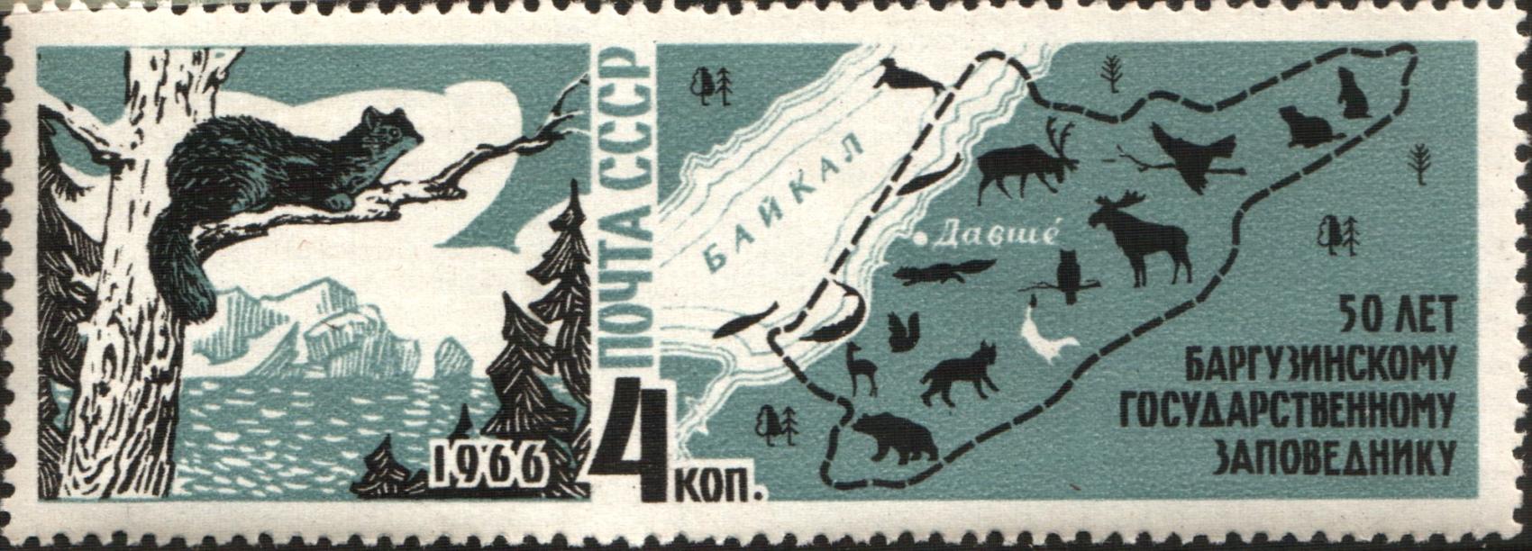 stamp with image of forest life on left and map on right