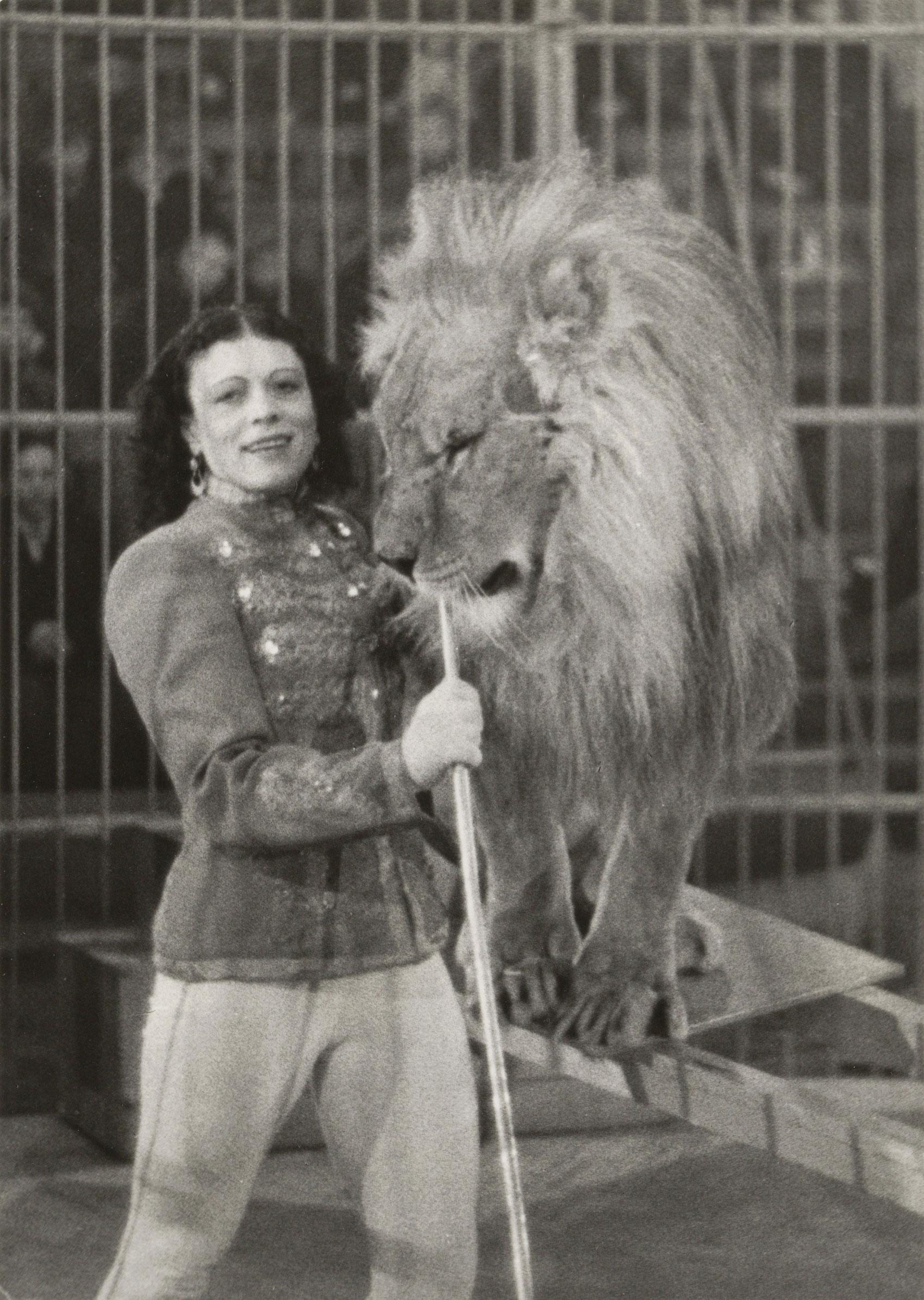 Irina Bugrimova poses with a tamed lion.