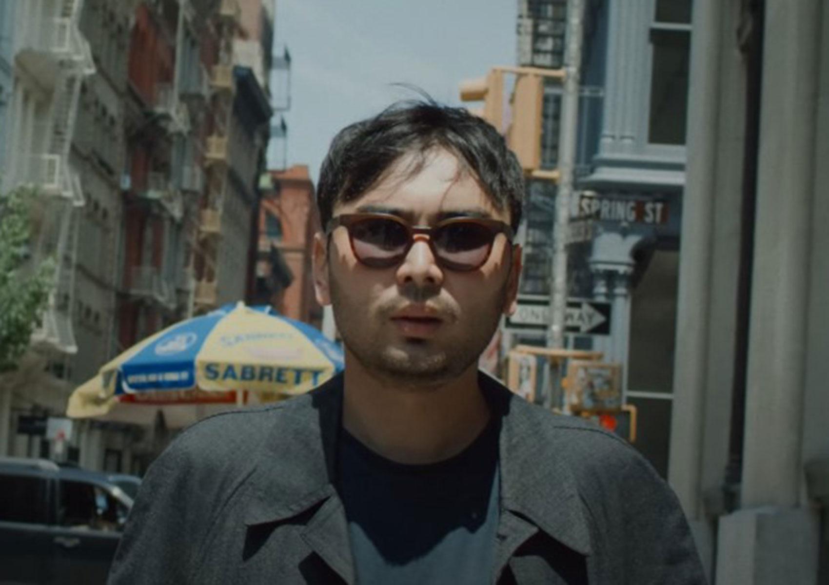 Man standing on a city street.