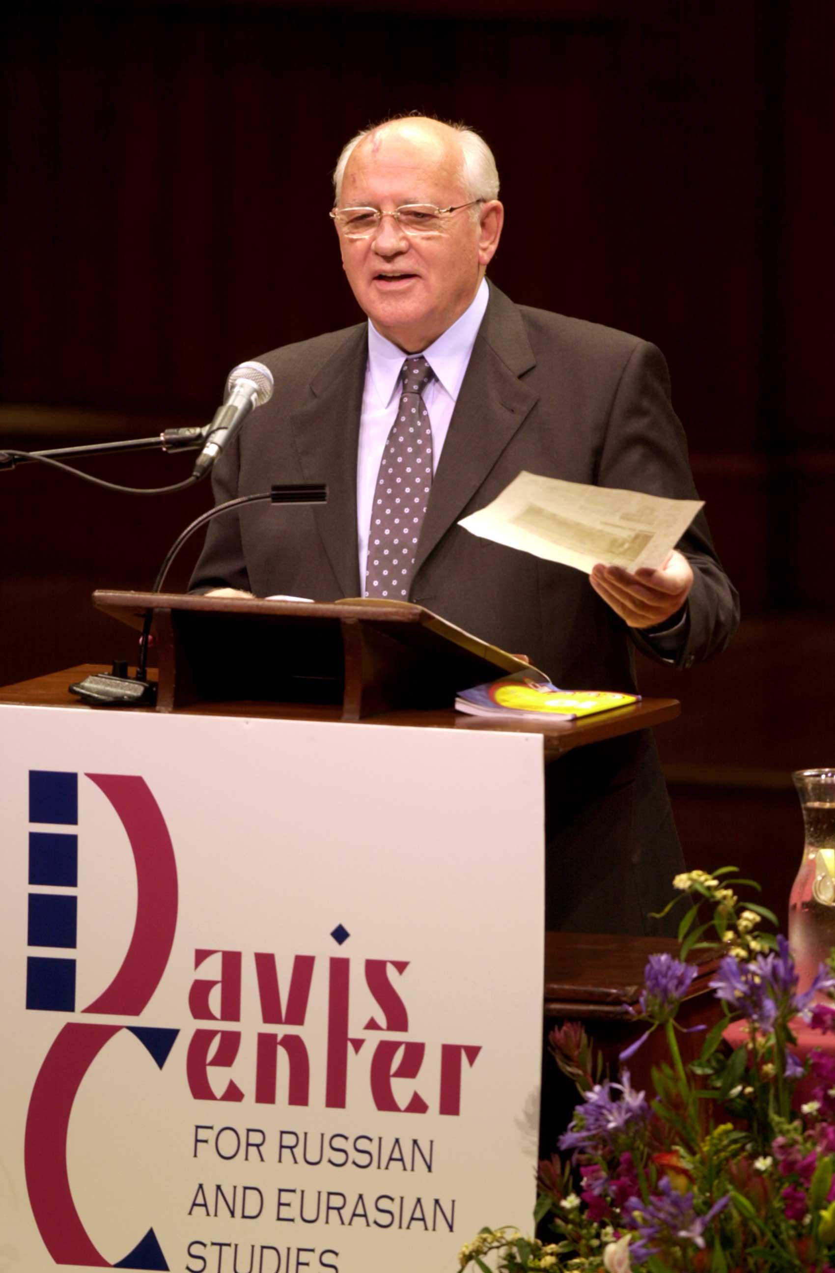 Mikhail Gorbachev at podium with Davis Center logo