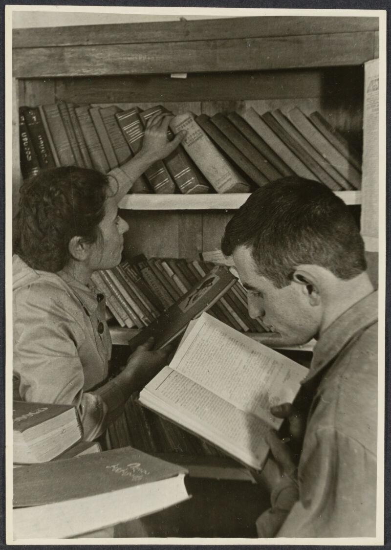 P. Lutsenko. “The library of a collective farm in Potora, near Poti, Georgia. Shalva Silagayev, a field brigade leader, selects books for reading." Soviet Information Bureau Photograph Collection. Davis Center Collection at Fung Library, Harvard.