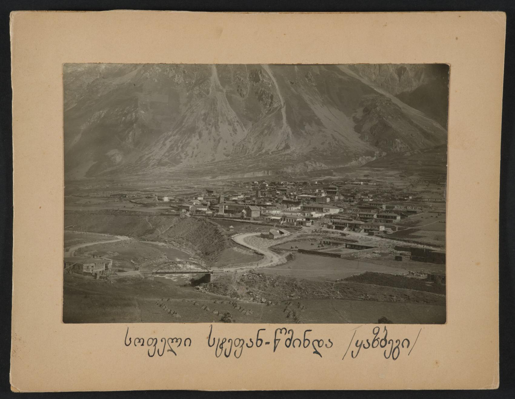 Kazbegi village sepia photograph