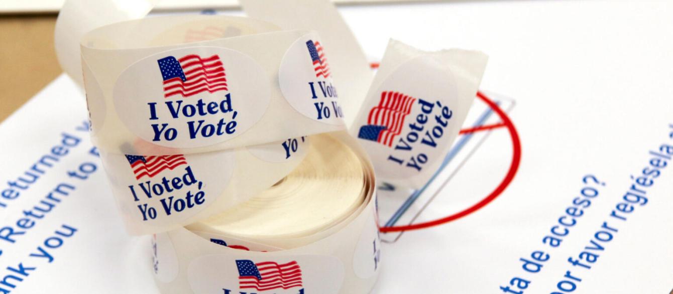 Voter stickers on a table.