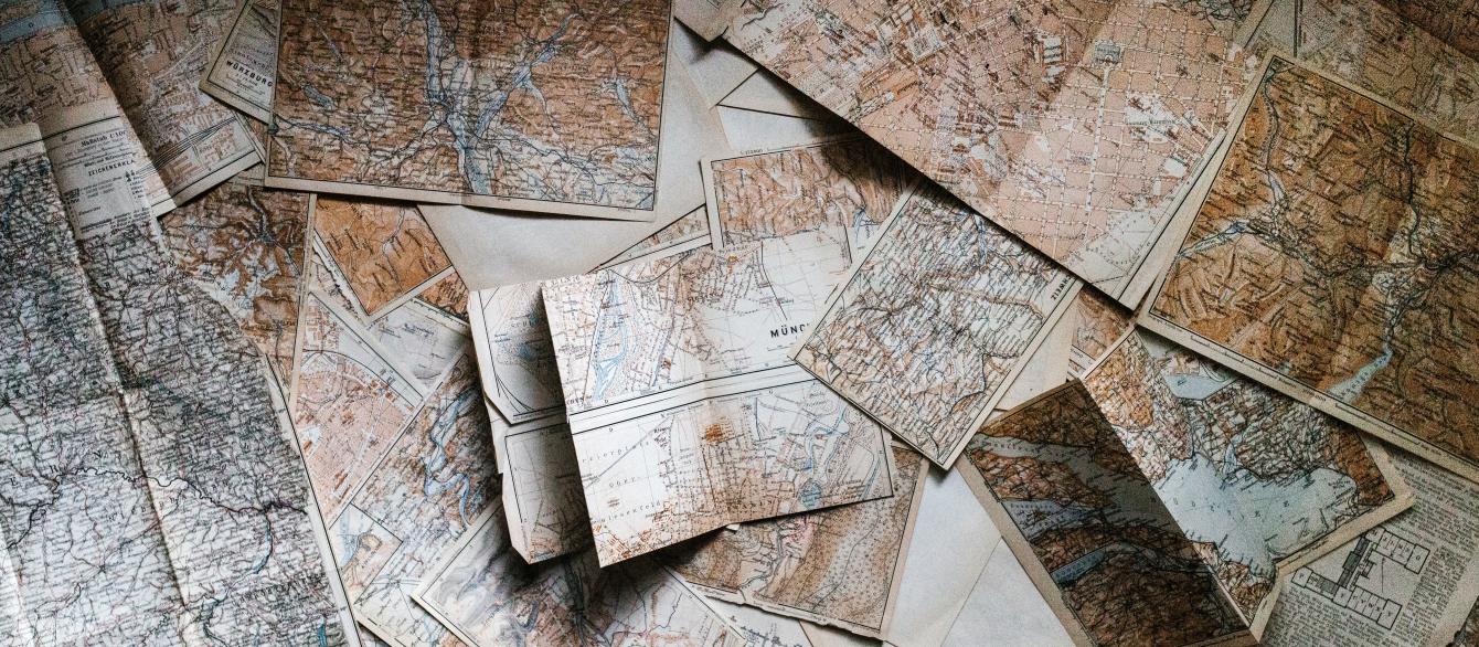 maps scattered on table