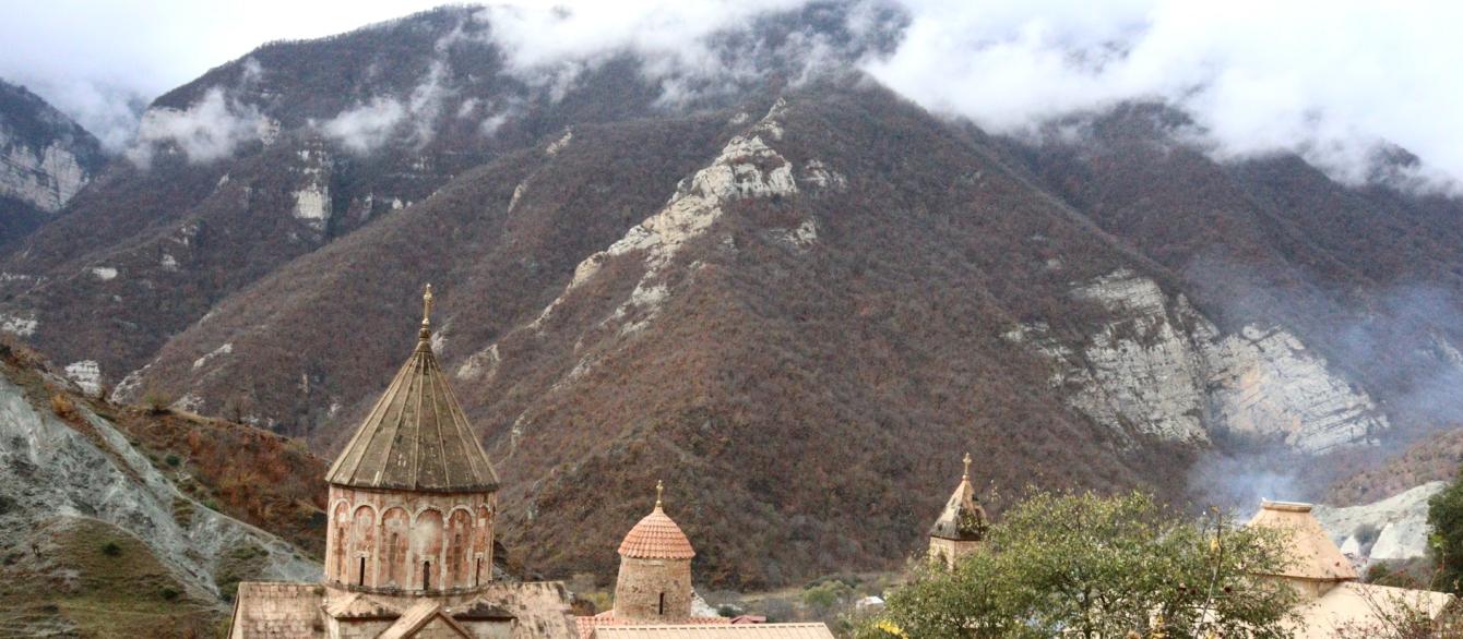 Armenian mountain landscape with an old church in the valley