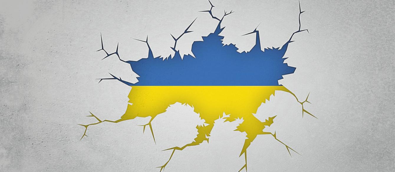 Ukraine flag in the fray cracking background