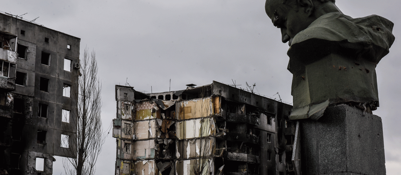 damaged houses by shelling and the head of Lenin, Ukraine