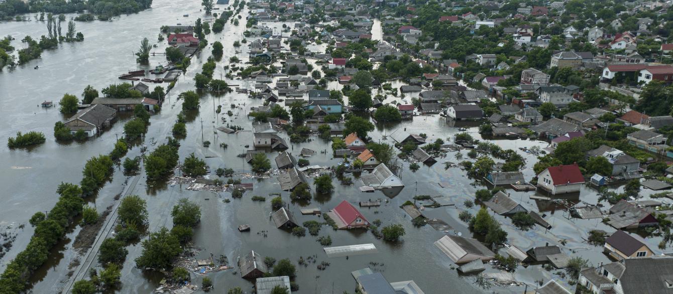 Houses are seen underwater and polluted by oil in a flooded neighbourhood in Kherson, Ukraine, Saturday, June 10, 2023. The destruction of the Kakhovka Dam in southern Ukraine is swiftly evolving into long-term environmental catastrophe. It affects drinking water, food supplies and ecosystems reaching into the Black Sea. (AP Photo)