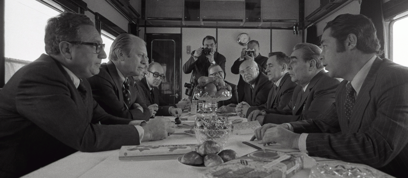 Photograph of President Gerald Ford, Secretary of State Henry Kissinger and Other U.S. Representatives Meeting with Soviet General Secretary Leonid Brezhnev, Foreign Secretary Andrei Gromyko, Soviet Ambassador Anatoly Dobrynin, and Others aboard a Soviet Train Headed for Vladivostok