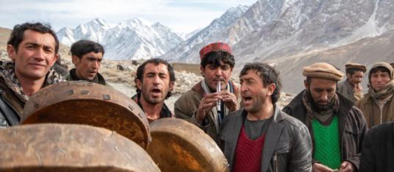 Men singing amidst mountains