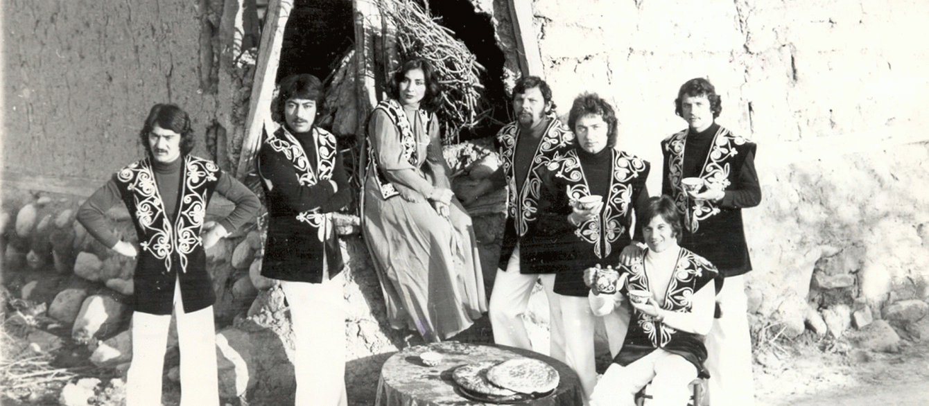 black and white phot of the band in 70s outside the tent