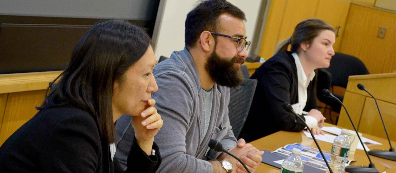    Speakers at a conference panel 