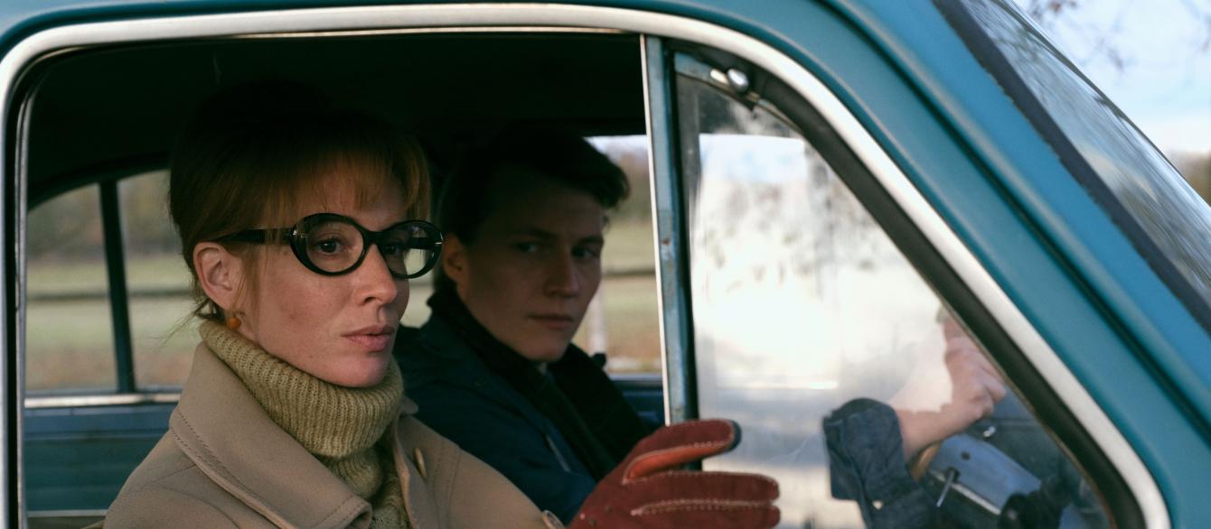 a shot of women and a man in the car