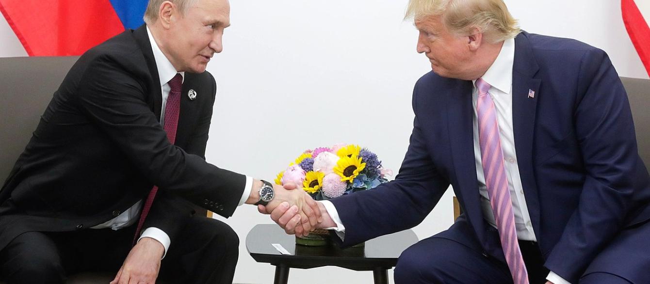 Putin and Trump shaking hands, 2019
