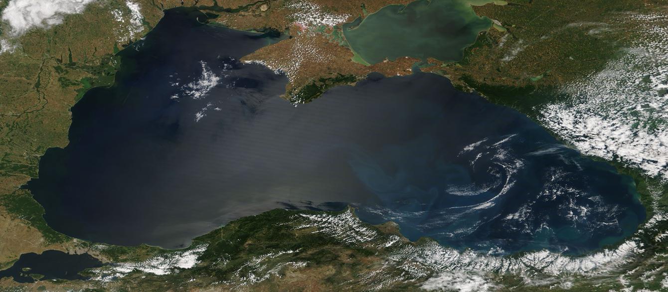 Swirls of color brighten the deep blue waters of the Black Sea