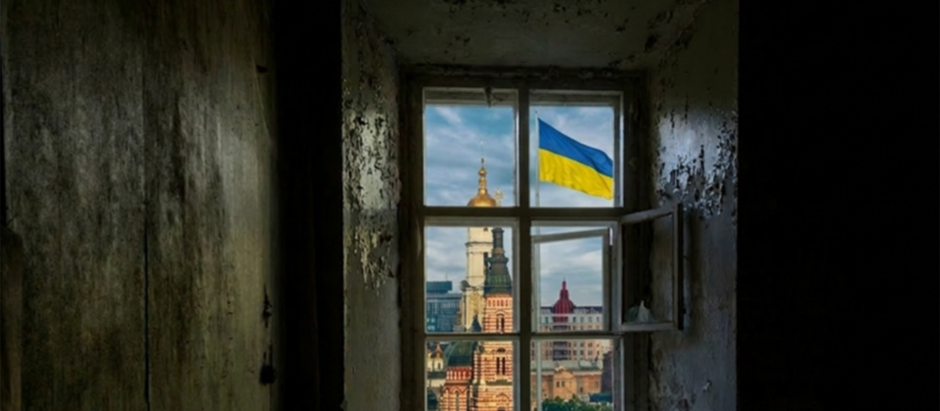 window looking out to the city with Ukraine flag