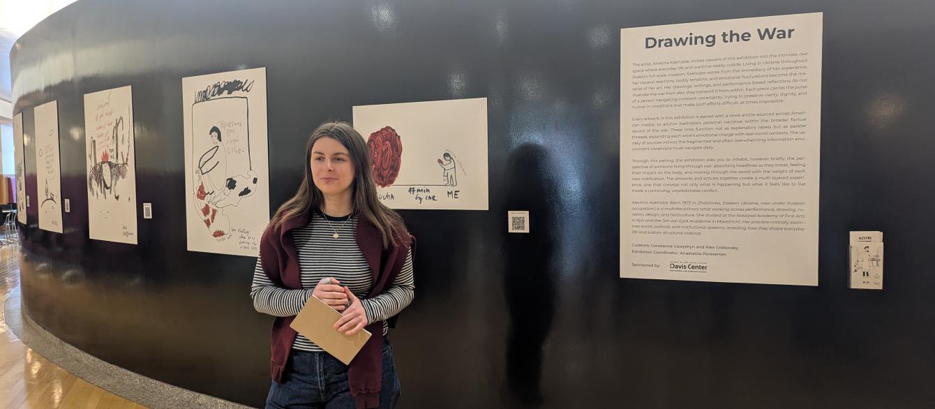 Ana Pereverten discussing art exhibit. 