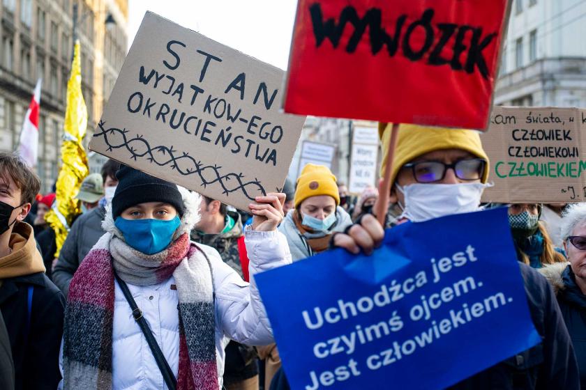 People in Poland protesting with signs