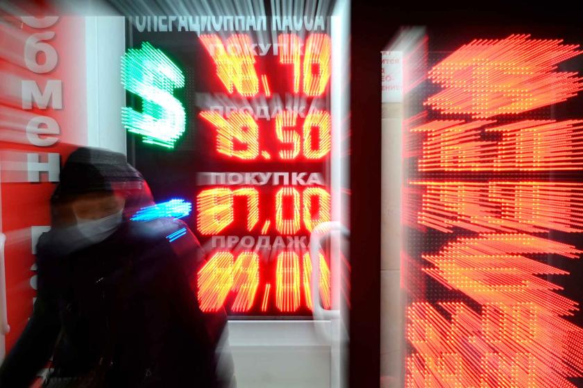 An electronic scoreboard with information about the exchange rate is seen at a currency exchange office in Moscow, Russia.