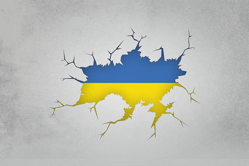 Ukraine flag in the fray cracking background