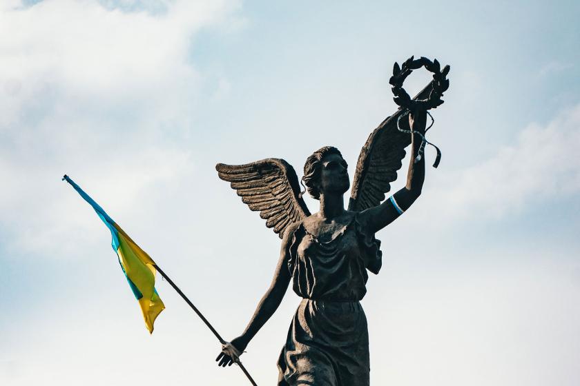 Ukrainian flag tied to Statue of Victory