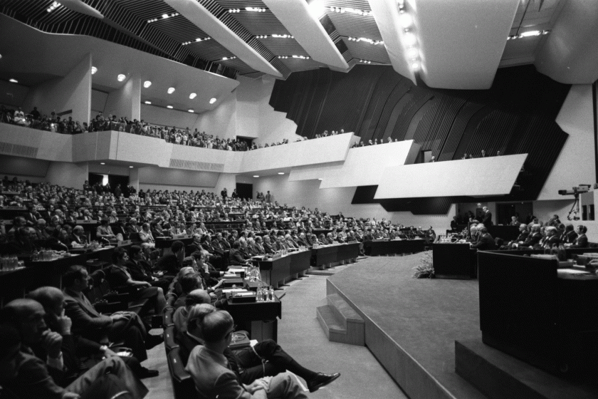 Conference room in black adn white with many men