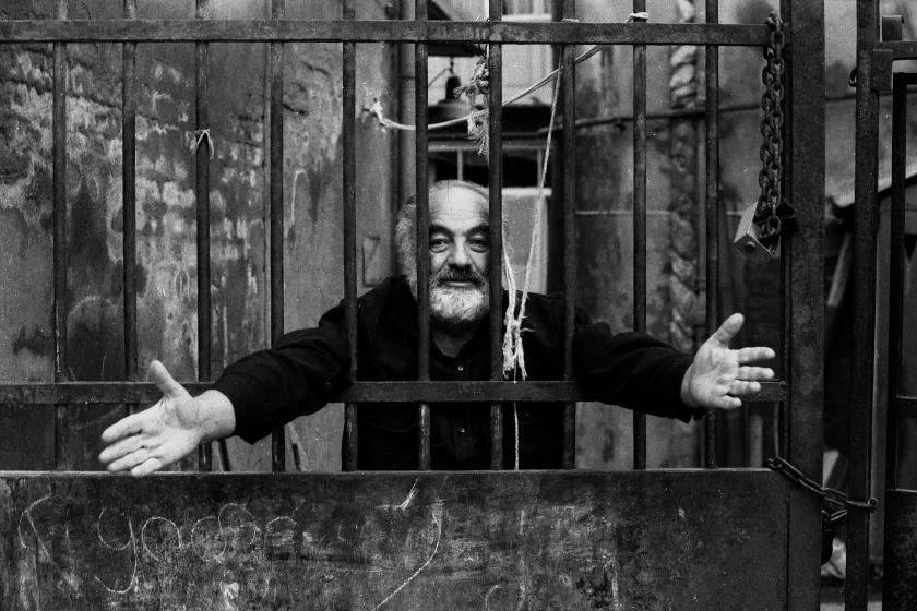 black and white photo of sergei parajanov behind the bars