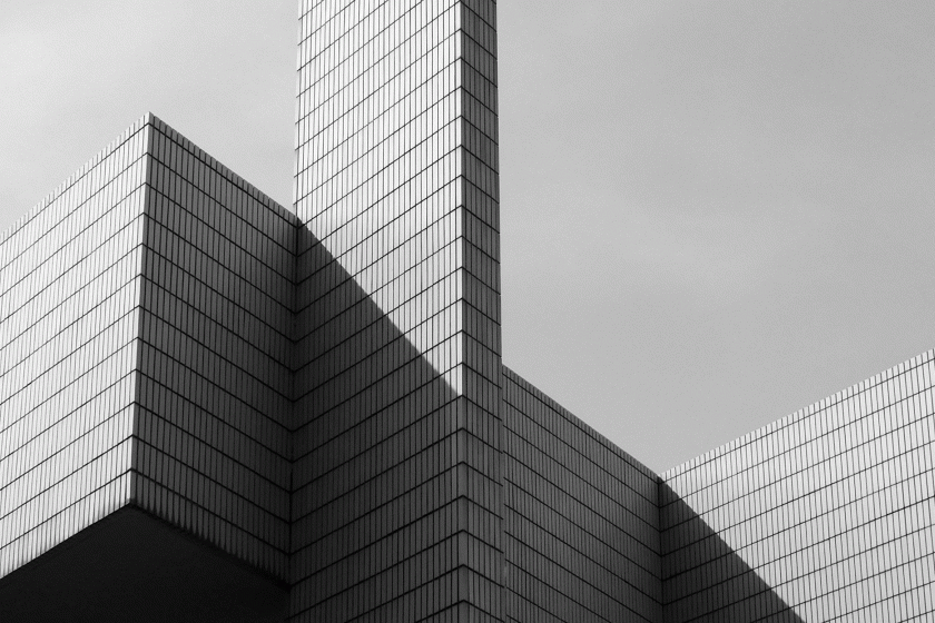 black and white photo of the building dropping shadow