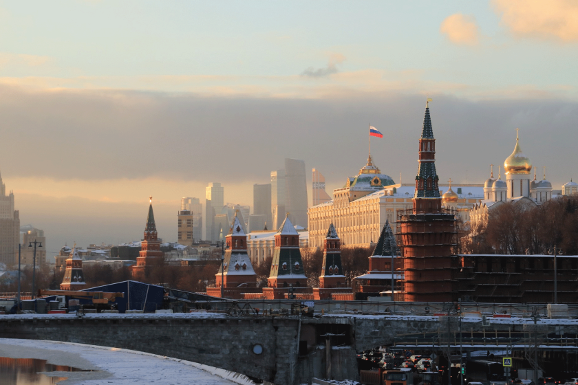 An Image of Moscow, Russia, featuring the Kremlin building at sunset.