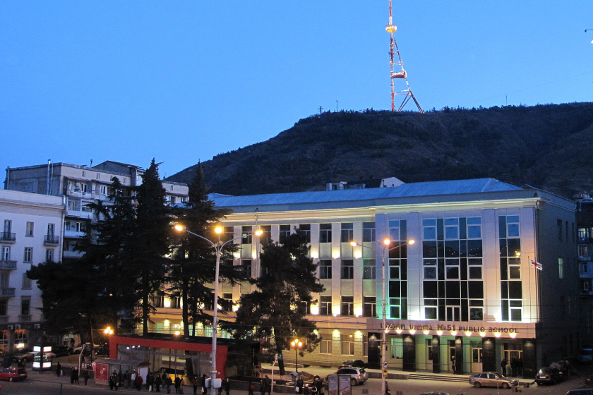 Tbilisi Public School #51 in Melikishvili Street with Mt. Mtatsminda and Tbilisi TV tower in the background. View from the Tbilisi Philharmonic Hall