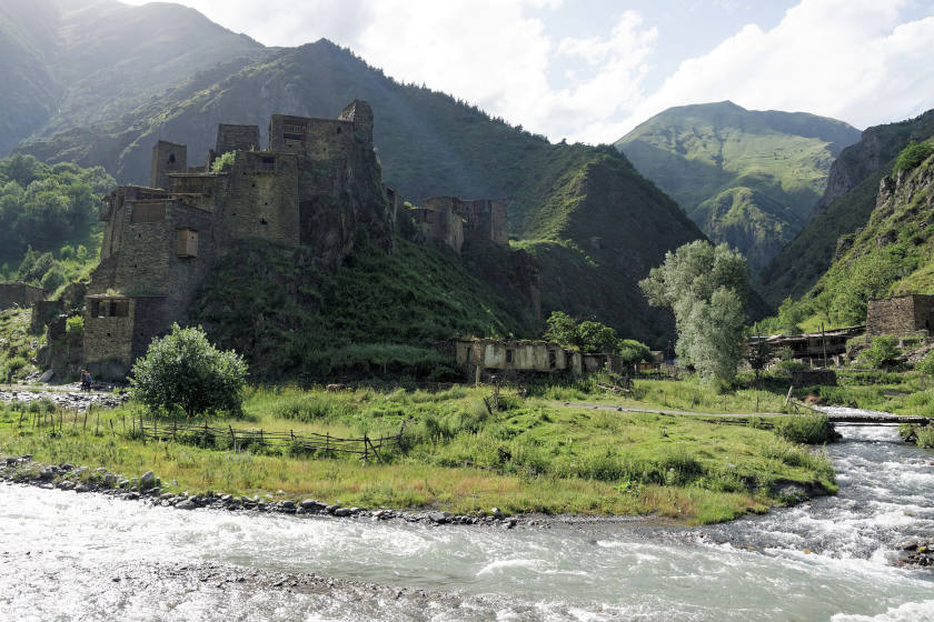 The Village-Fortress of Shaili in Georgia surrounded by green mountains and running water