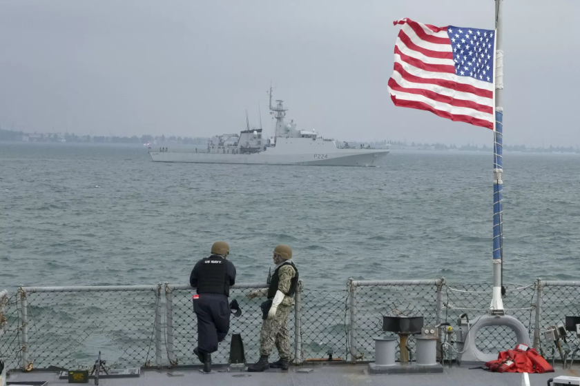 Members of the U.S. Navy of the Arleigh Burke-class guided-missile destroyer USS Ross look on Britain's Royal Navy patrol ship OPV "Trent" in Sea Breeze 2021 maneuvers in the Black Sea, July 7, 2021. Ukraine and NATO have conducted Black Sea drills involving dozens of warships in a two-week show of their strong defense ties and capability following a confrontation between Russia's military forces and a British destroyer off Crimea last month.