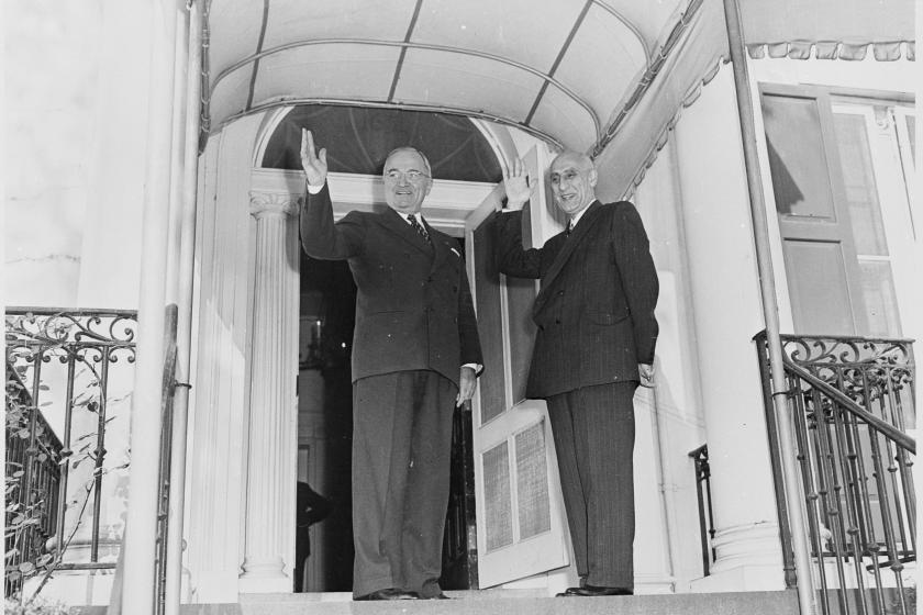 Black and white photograph of president Truman and Mohammad waving