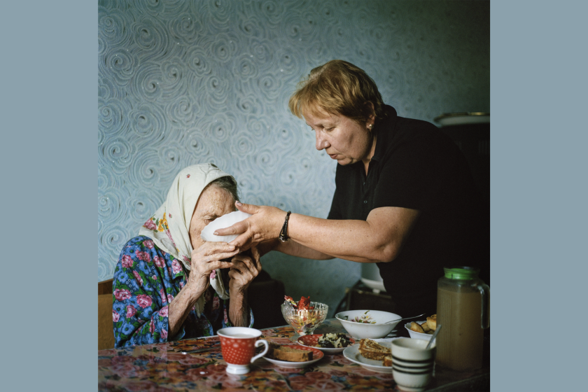 Tatiana Batskalyova caring for her 90-year-old mother-in-law, Lira, in Avdiivka, 2019.
