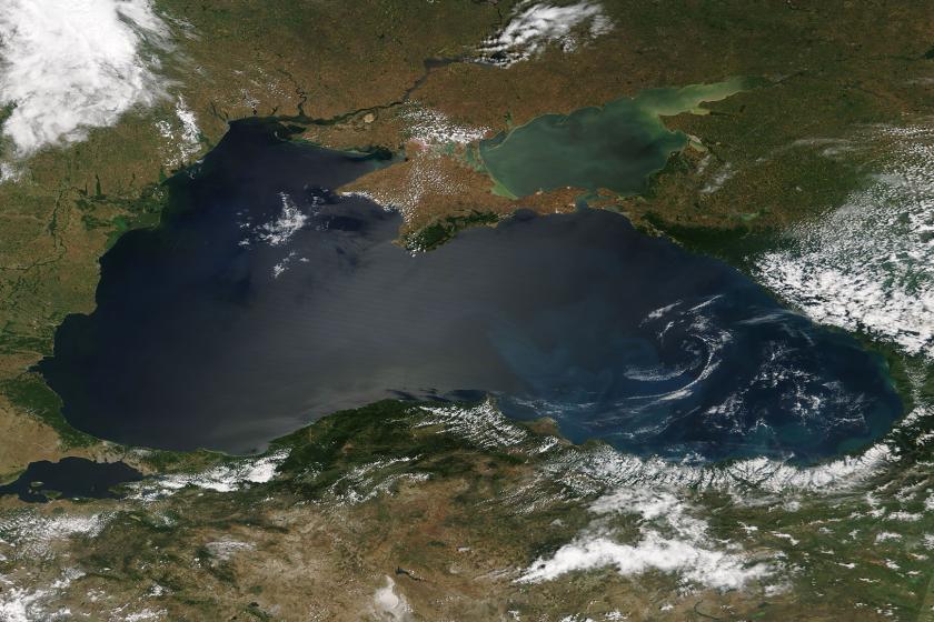 Swirls of color brighten the deep blue waters of the Black Sea