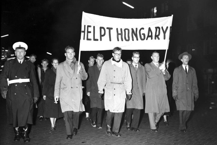 black and white picture with protesters carrying banner