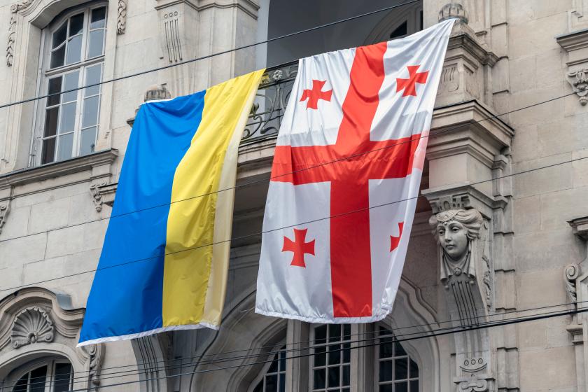 Ukrainian and Georgian flag side by side, in a Georgian street
